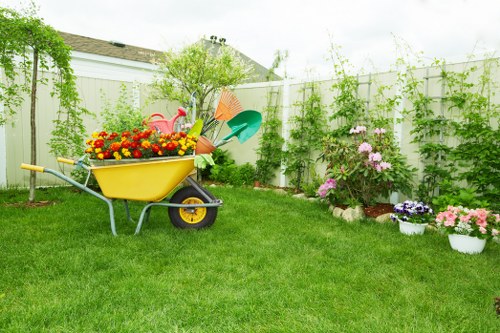 Gardener inspecting a garden before starting work in Tulse Hill